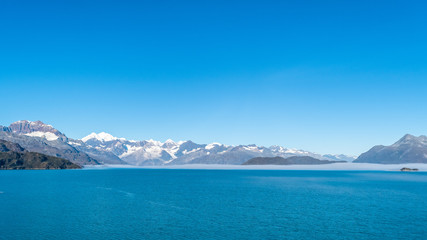 Glacier Bay National Park, Alaska. Spectacular sweeping vista of ice capped/ snow covered mountains, glaciers, wildlife landscape. Absolutely breathtaking natural untouched serene nature views.