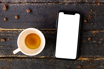 Mobile phone mock up and white empty coffee cup.Composition for coffee shop and coffee