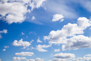 Obraz na płótnie Canvas Blue summer sky with white light clouds