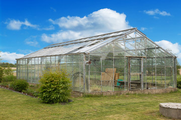 Fototapeta na wymiar Old greenhouse made from a glass blocks 