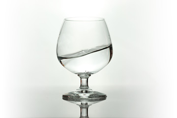 Water spray in wineglass. Water splash.