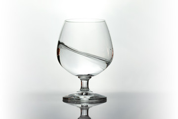 Water spray in wineglass. Water splash.