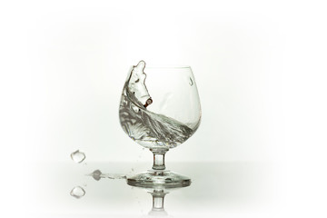 Water spray in wineglass. Water splash.