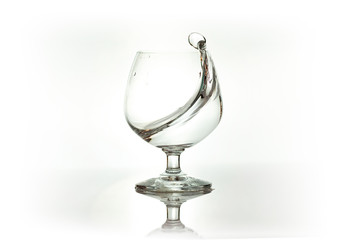Water spray in wineglass. Water splash.