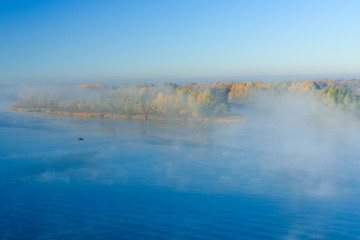 Fog over the water on a river Dnieper on autumn