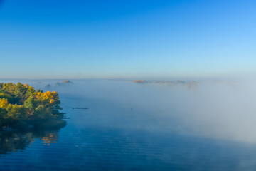 Fog over the water on a river Dnieper on autumn