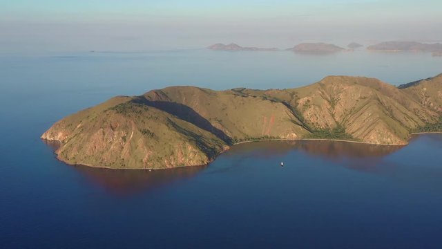 Afternoon light illuminates the scenic island of Gili Banta, just outside of Komodo National Park, Indonesia. This tropical area is known for its marine biodiversity.