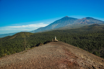 Fototapeta premium View of Mountain Teide from the top of Volcano Arenas Negras. Bright blue sky. Teide National Park, Tenerife, Canary Islands, Spain.