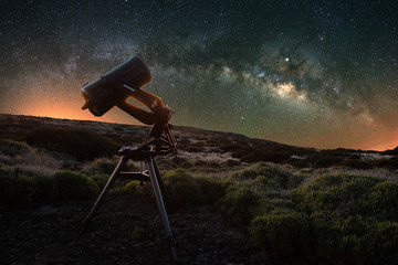 Telescope watching the Milky Way in the spring visible from Teide National Park near Observatory....