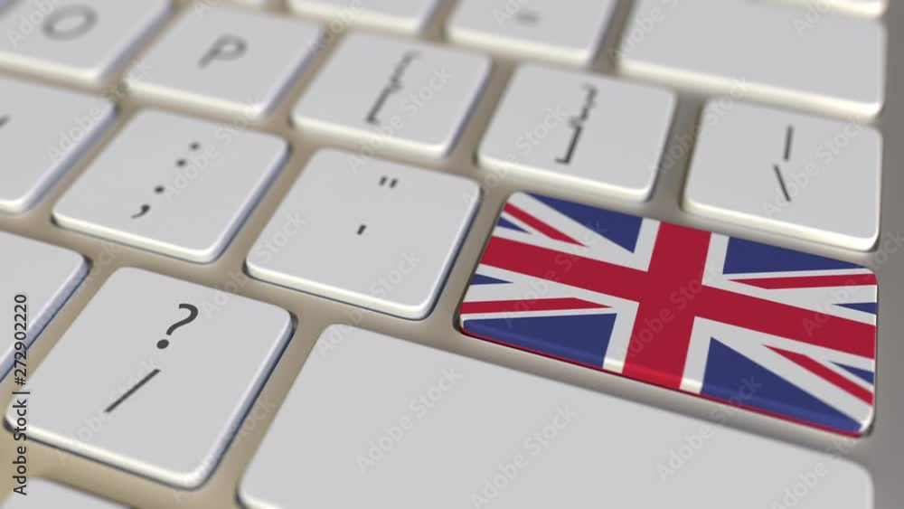 Poster key with flag of austria on the computer keyboard switches to key with flag of great britain, transl