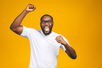 Portrait of excited young African American male screaming in shock and amazement. Surprised man...