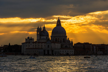 Obraz premium Beautiful Salute Basilica (Saint Mary of Helath) old domes at sunset in Venice