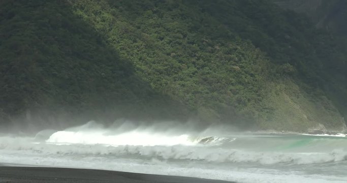 Large Waves Sweep Onto Rugged Mountainous Coastline - Megi