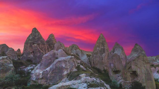 Cinemagraph of Cappadocia Turkey with sky time lapse at sunset behind ruins.
