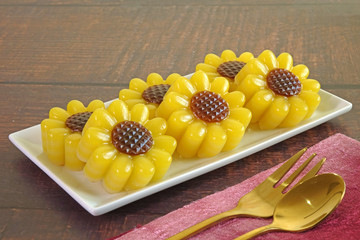 Thai dessert : Layer sweet cake (or Khanom Chan) Thai traditional dessert in beautiful sunflowers...