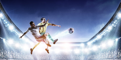 Soccer players on stadium in action. Mixed media