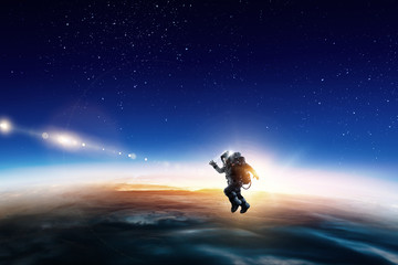 Astronaut in space on planet orbit.