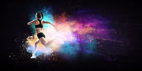 Fototapeta premium Fast running young woman. Mixed media