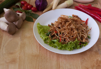 Vegetarian thai food,stir-fried rice noodles spicy ,on wooden background