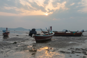 boat on the beach at sunset