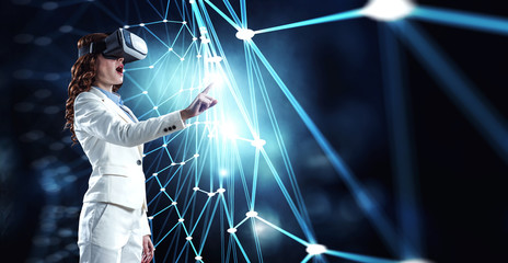 Young female in virtual reality. Mixed media