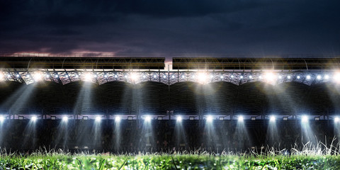 Football stadium background with flying ball