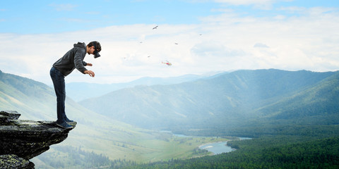Virtual reality experience, young man in VR glasses