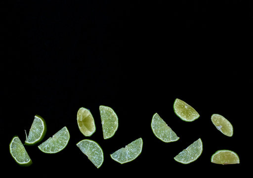 A Triangular Wedge Of Lime On A Black Velvet Background