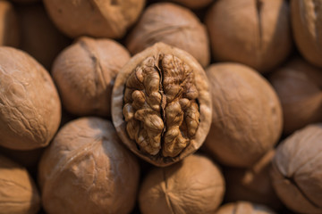 Walnuts with and without shells closeup