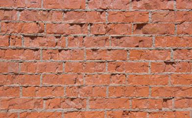 Red brick wall in daylight