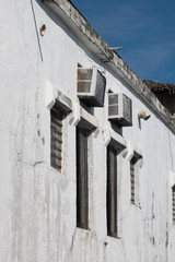 A white concrete wall with windows