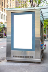 Blank billboard at bus stop for advertising, New York city buildings and street background - obrazy, fototapety, plakaty
