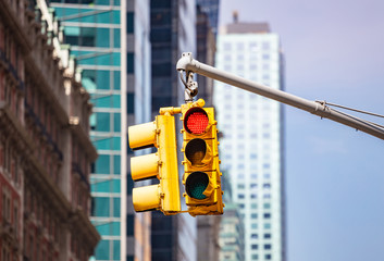 Red traffic lights for cars, blur office buildings background