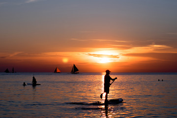 Fototapeta premium The lifeguard boat on the sunset beach