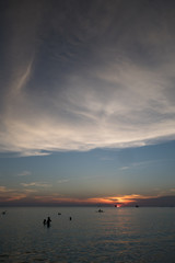 Obraz na płótnie Canvas The sunset cloudscape view of the beach