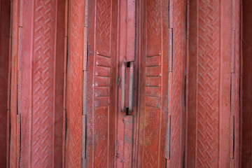 Fototapeta premium A detail of the metal folding door of the entrance