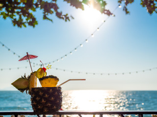 Pineapple juice cocktail near the beach in summer