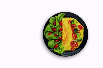 top view of homemade omelette with salad on plate isolated over white background. Healthy food concept. Flat lay