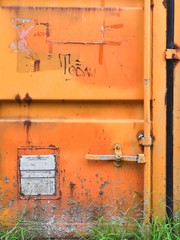 old metal door with lock Orange and Grey background