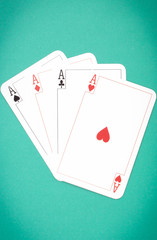 Four aces on green background. Gambling risk concept