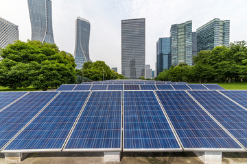Solar and modern city skyline