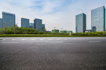 Panoramic skyline and modern business office buildings with empty road,empty concrete square floor
