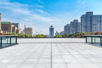 Panoramic skyline and modern business office buildings with empty road,empty concrete square floor