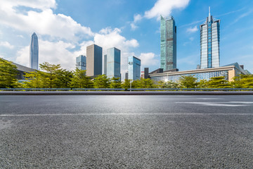 Panoramic skyline and modern business office buildings with empty road,empty concrete square floor