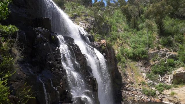 Water cascading down waterfall in beautiful Australian wilderness