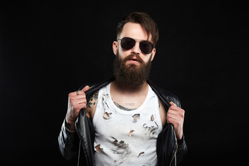 fashionable tattooed handsome man in sunglasses