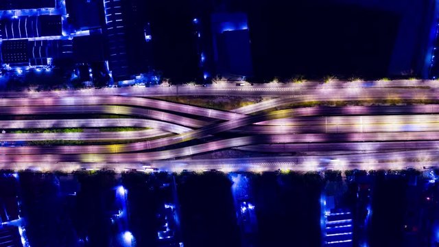 Hyperlapse of Drone Aerial View of Urban Highway Road Junctions at Night. The Intersecting Freeway Road Overpass The Outer Ring Road.