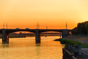 Fototapeta na wymiar Road bridge to the river Volga city Tver at sunset.