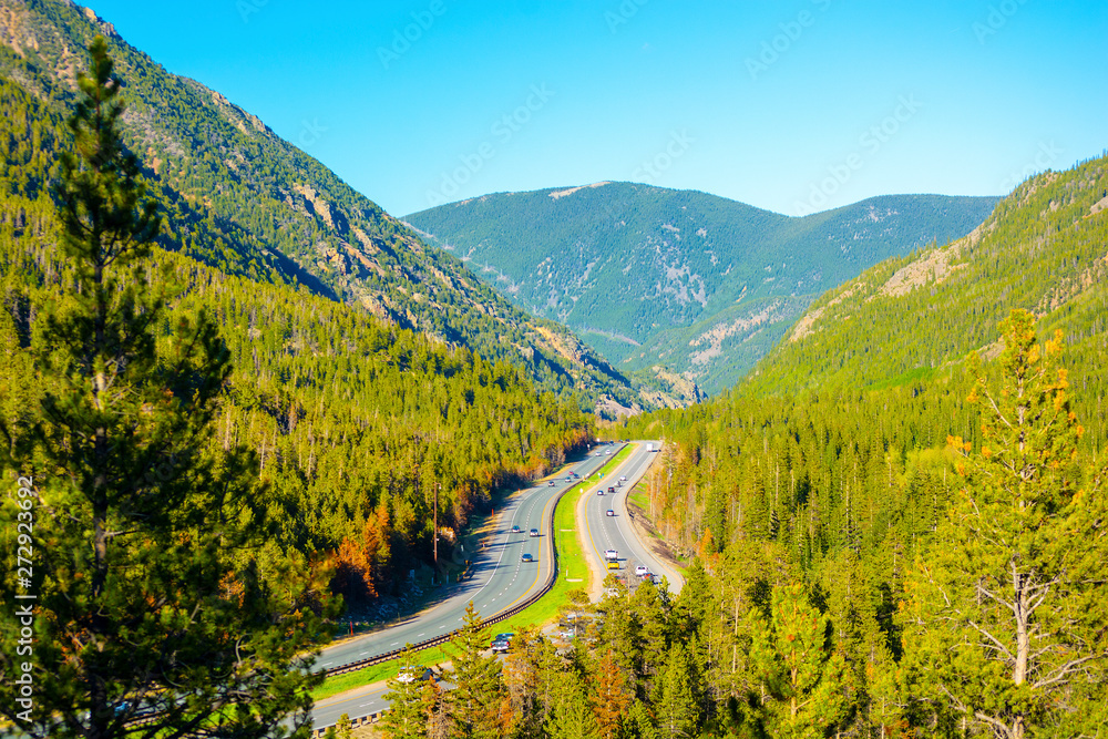 Wall mural Interstate 70 (I-70) in the Rocky Mountains of Colorado on a Sunny Day