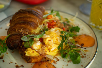 Croissant with scrambled eggs